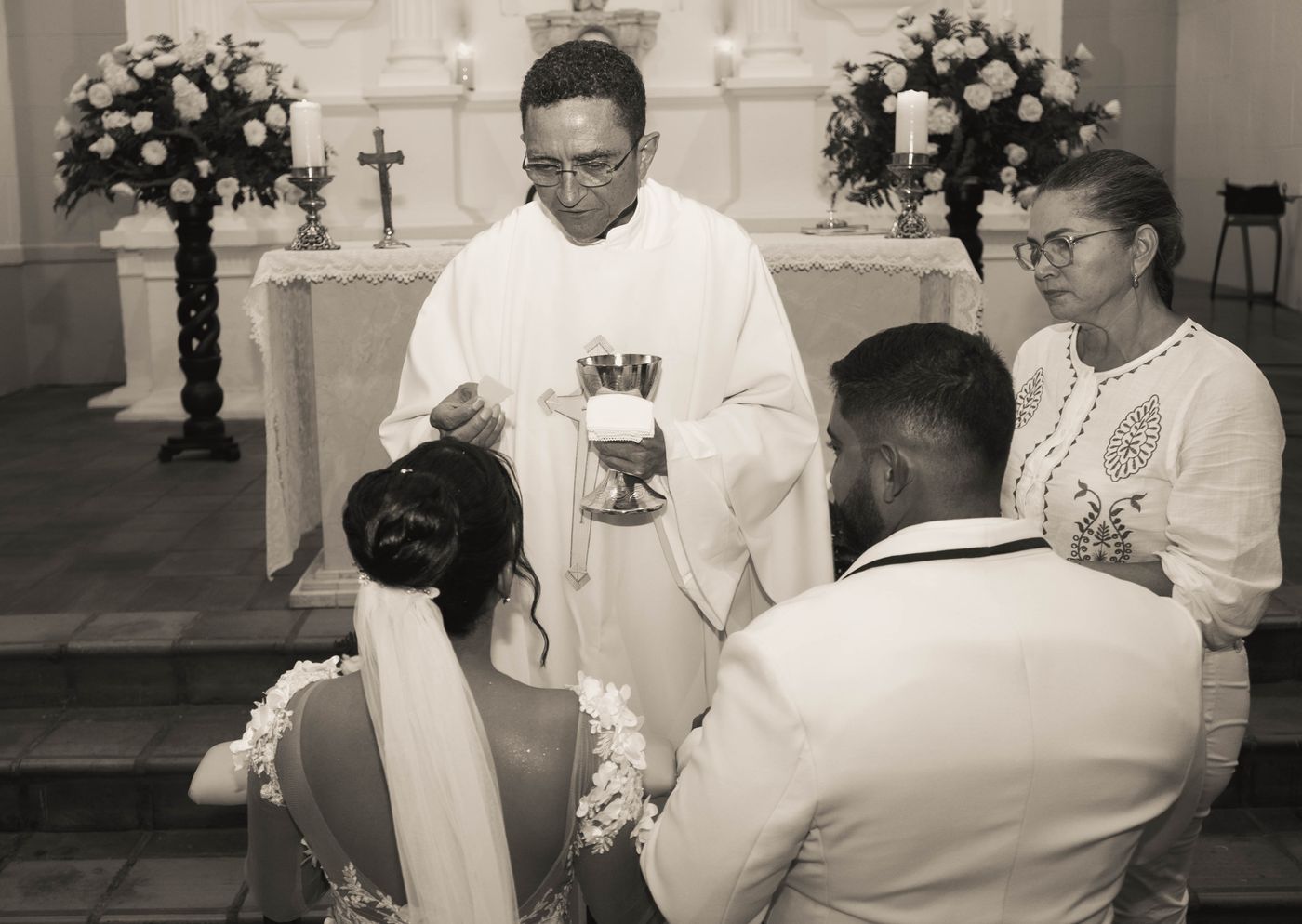A couple receiving a blessing during a church wedding